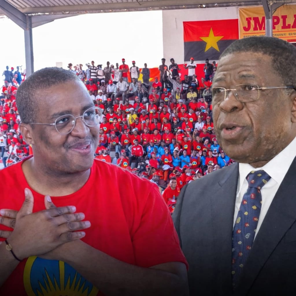 comício da JMPLA, com bandeiras e militantes em destaque, simbolizando a estrutura da organização sob o peso do atual cenário político.